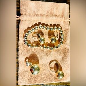 Elegant Sterling Silver Jewelry Set- Bracelet, earrings, ring, and pendant.